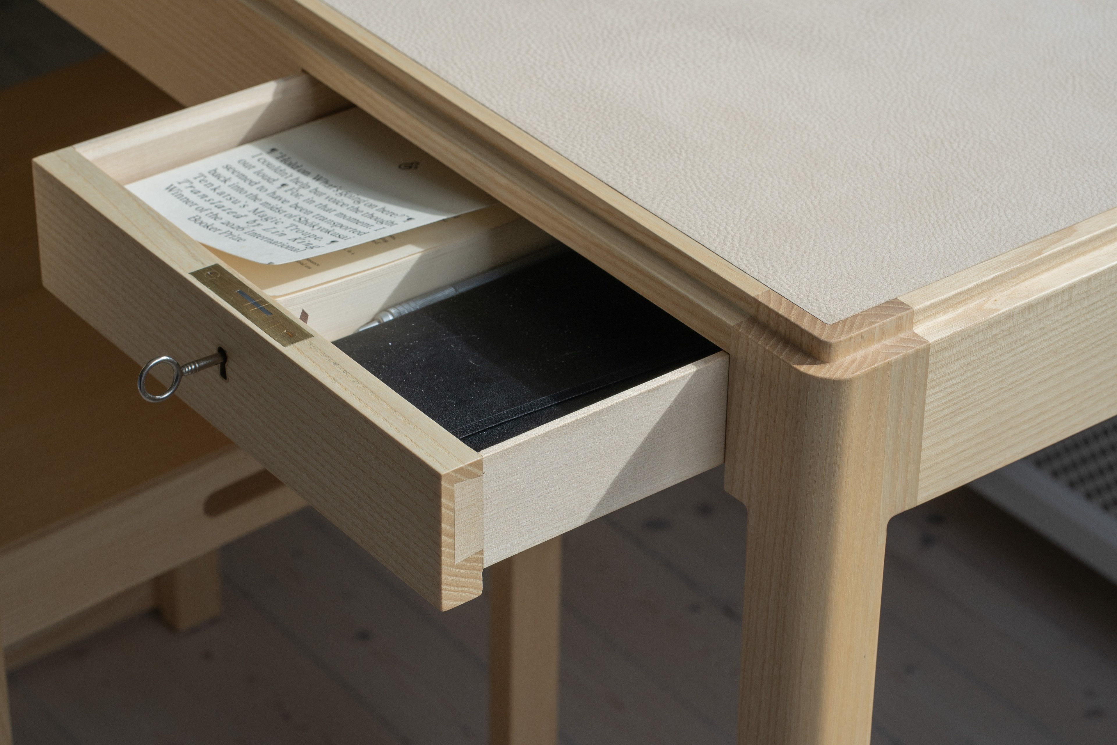 Open drawer with a brass key
